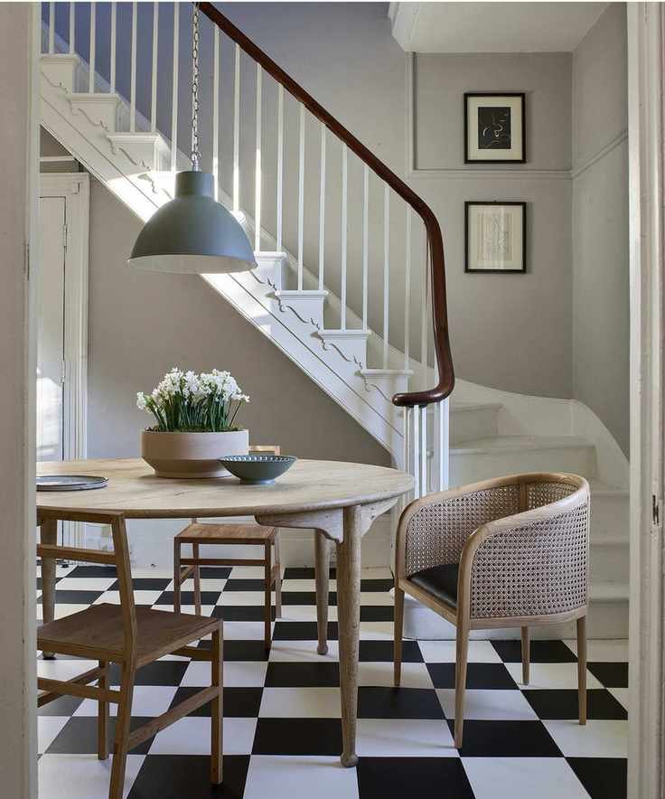 A dining area with stylish hallway lighting