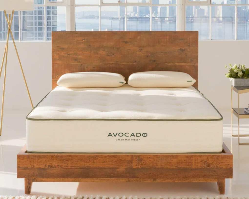 Avocado Green Mattress on a wooden bedframe.