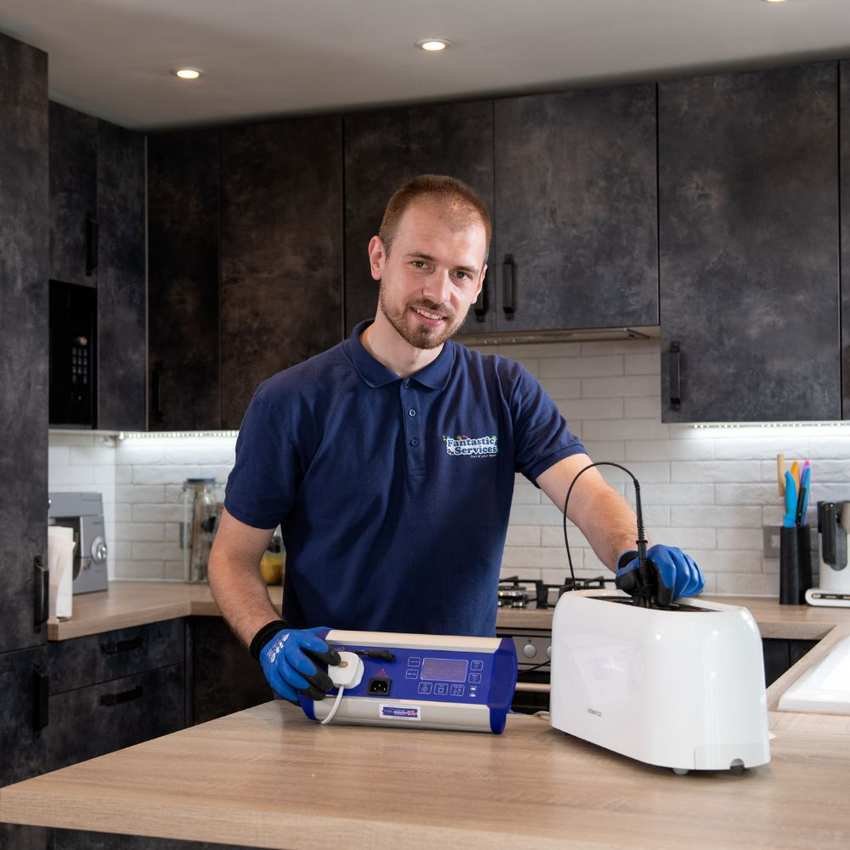 Headshot of David Miloshev in a kitchen