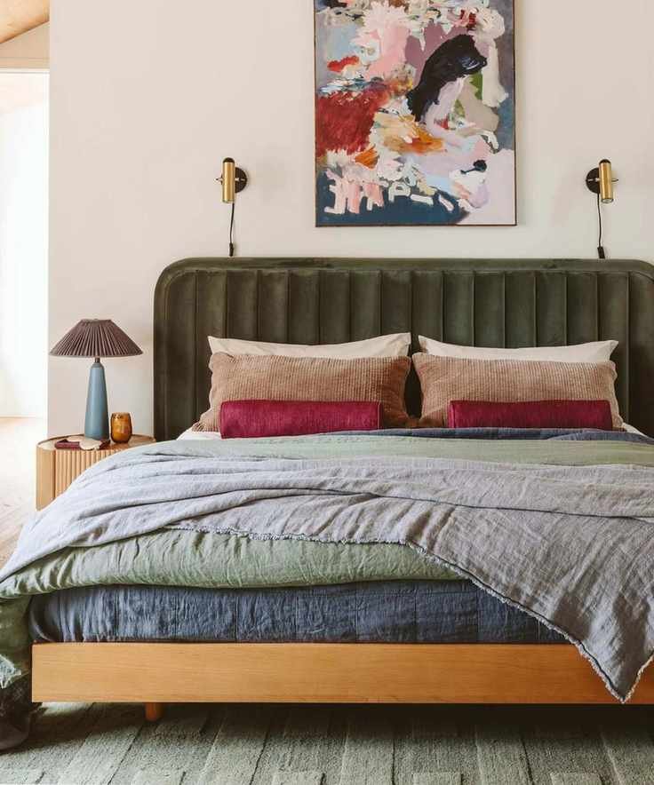 neutral and forest green layered bedroom designed by Emily Henderson