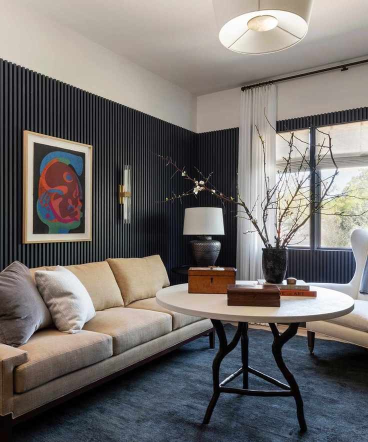 small living room painted in dark blue Mysterious with a Cloud White trim