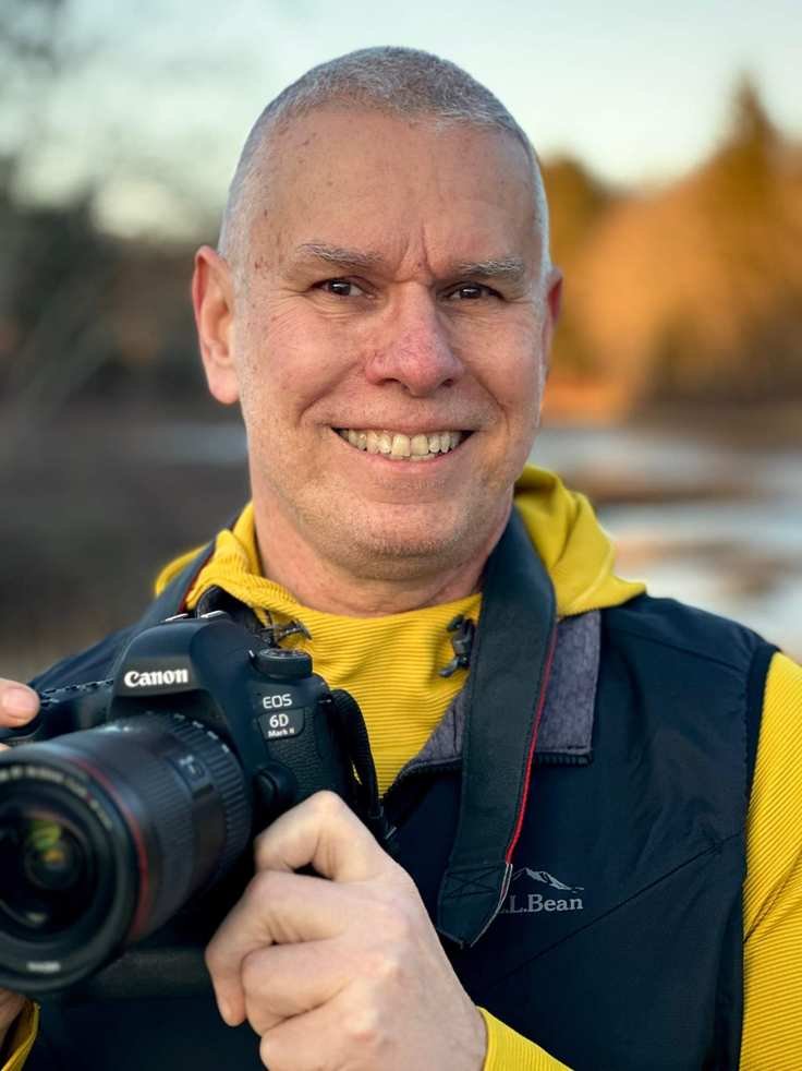 Matt Mattus holding a camera