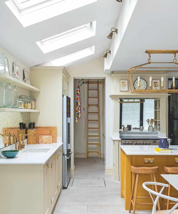 A sunny kitchen with tiled floors and a bright kitchen island
