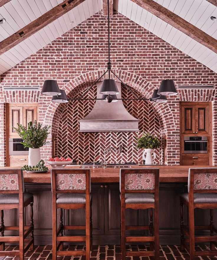 Traditional kitchen with a vaulted ceiling showcasing beams and paneling