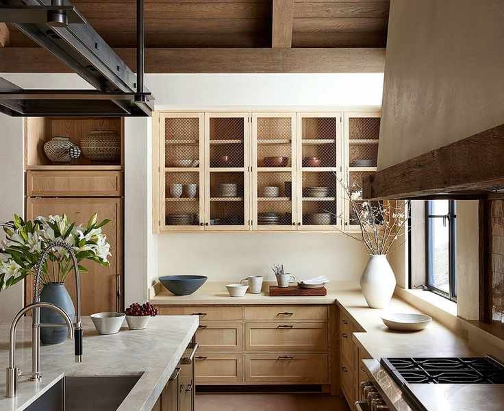 Kitchen with warm wood cabinetry and cream walls