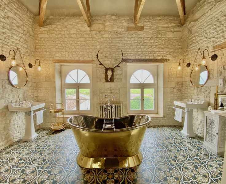 large country bathroom with twin basins and freestanding bath