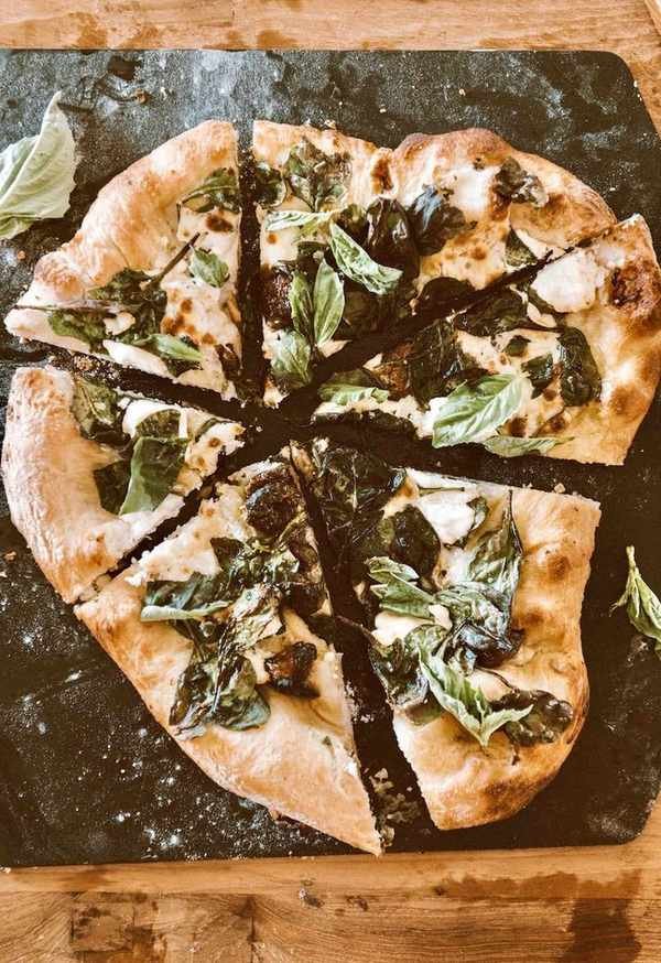 Homemade spinach ricotta pizza ready to serve
