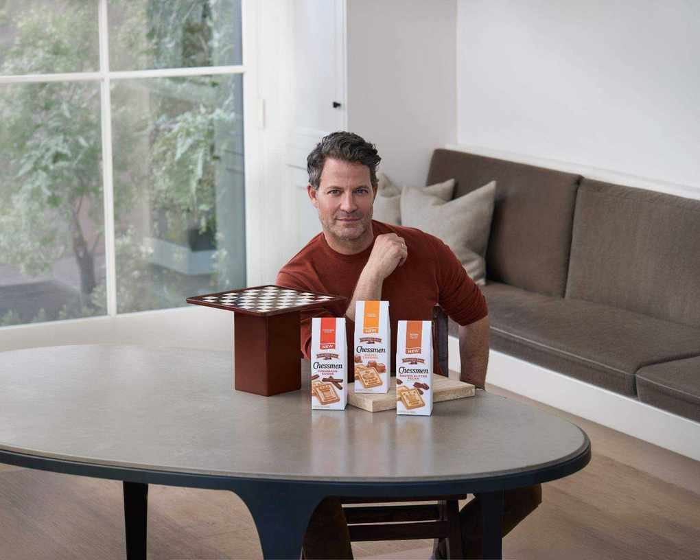nate berkus with his pepperidge farm chessman board