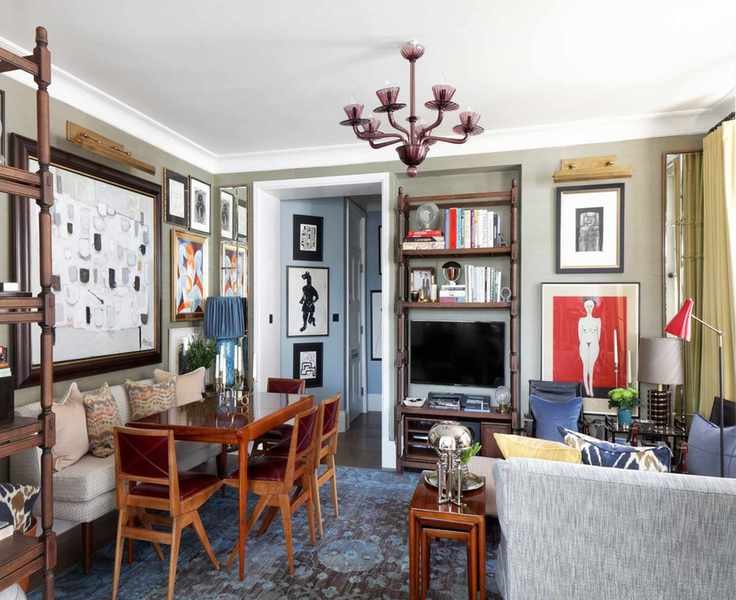 Living room with couch, dining table and chairs and banquette and neutral walls