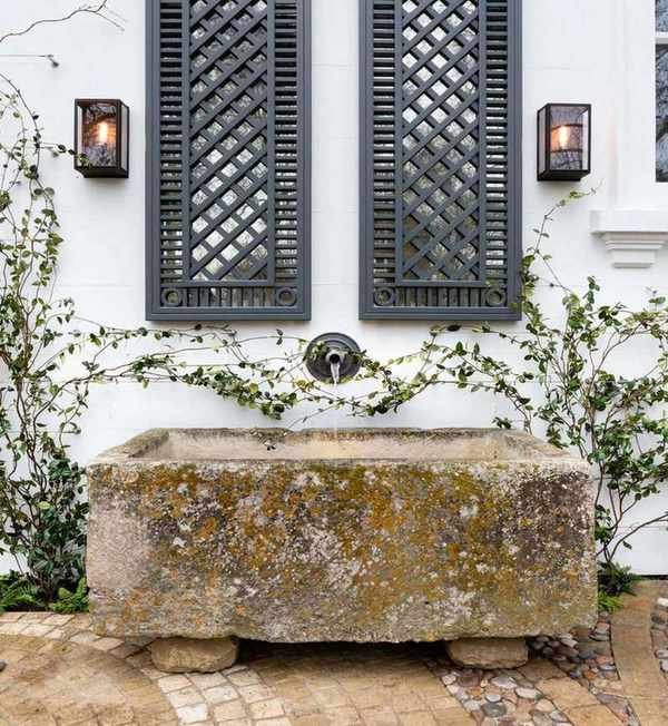 vintage lantern wall sconces with a vintage water trough by Butter Wakefield