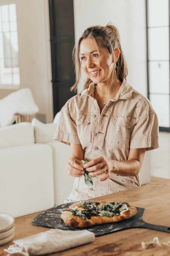 Homemade spinach ricotta pizza baked in oven on pizza stone