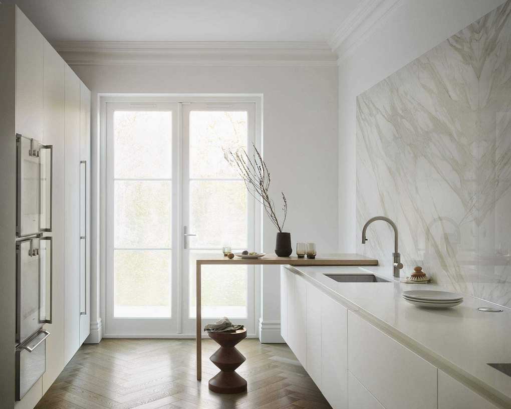 Modern kitchen with white color scheme and galley layout