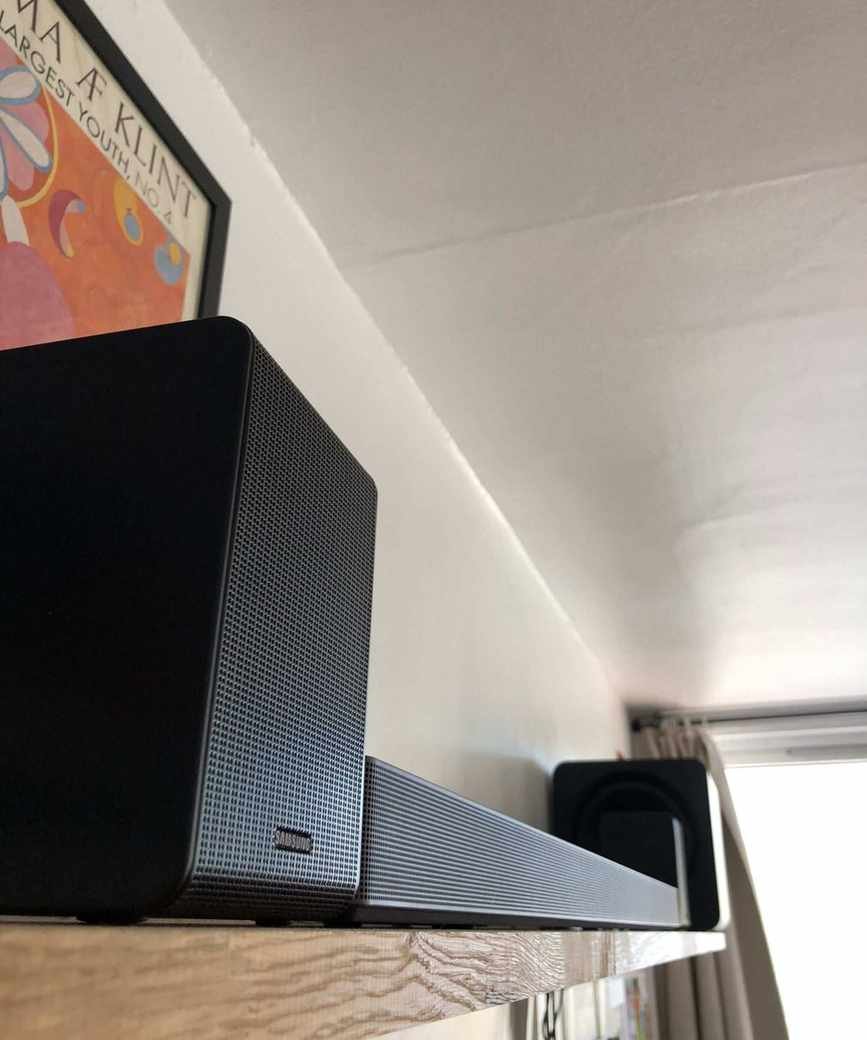 Samsung HW-QS750F soundbar on a shelf.