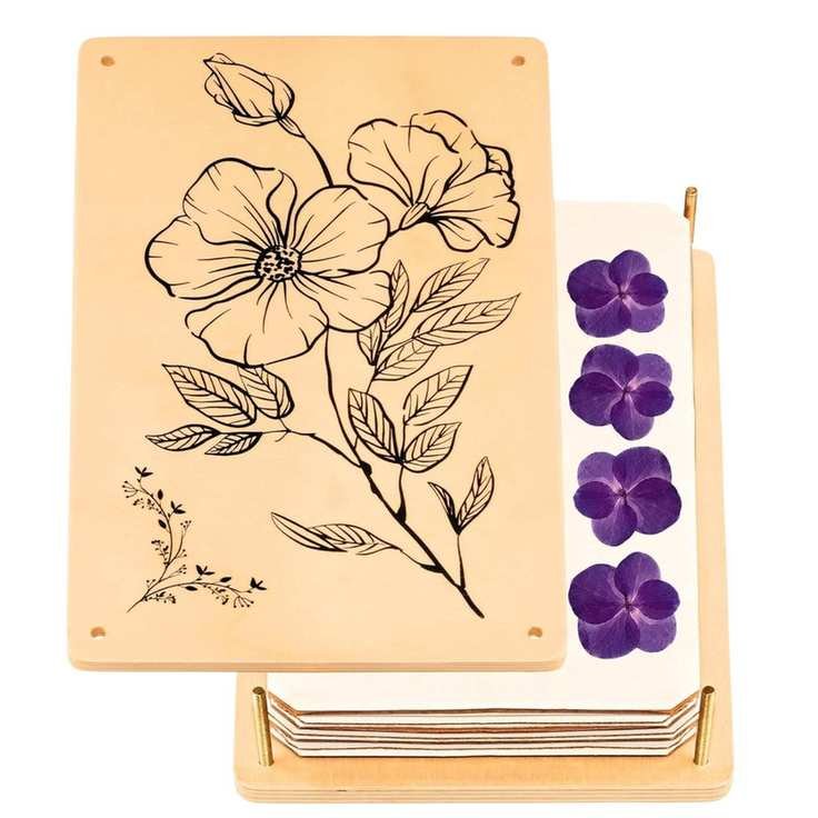 A wooden flower press