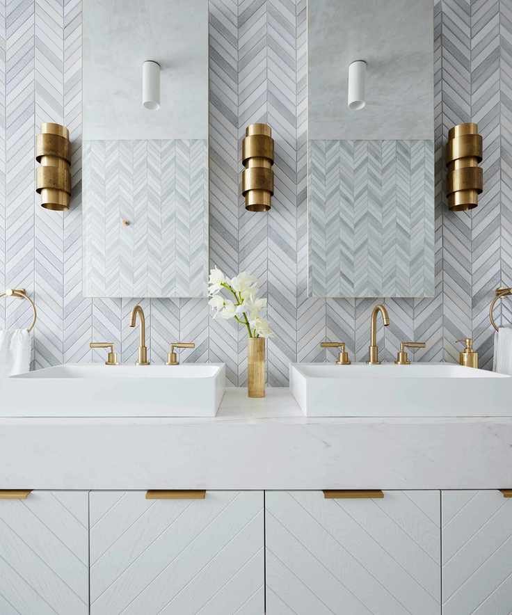 White bathroom with brass accents