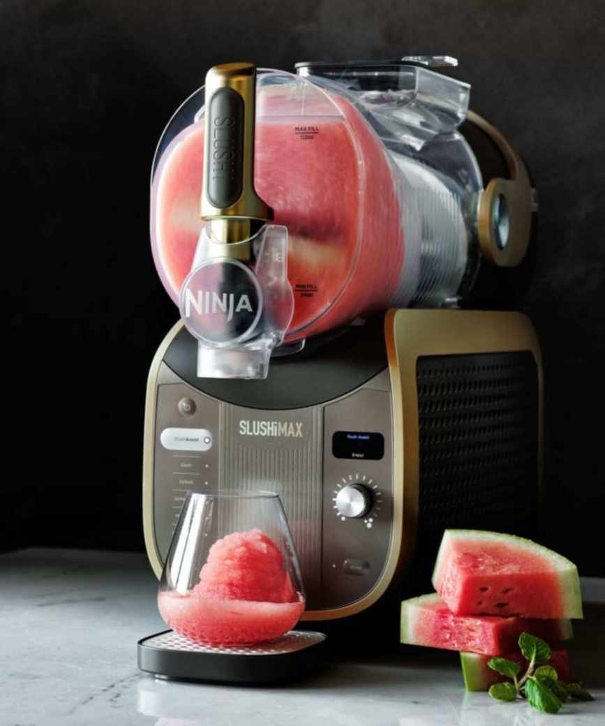 The Ninja SLUSHi Max filled with slush mix on a countertop.