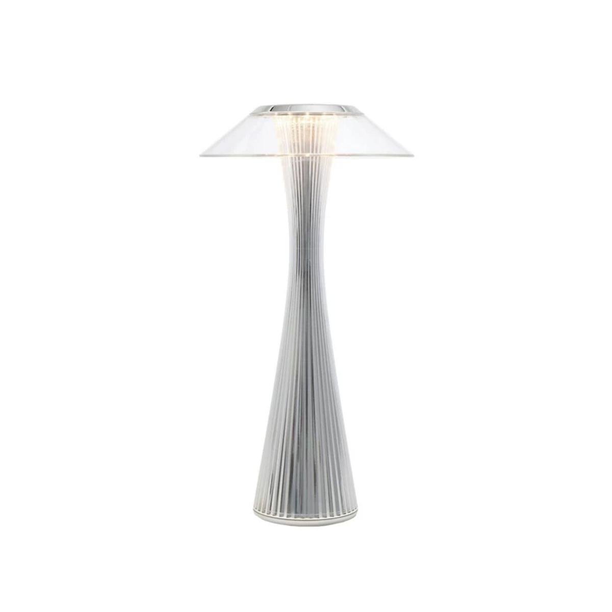 A chrome outdoor table lamp