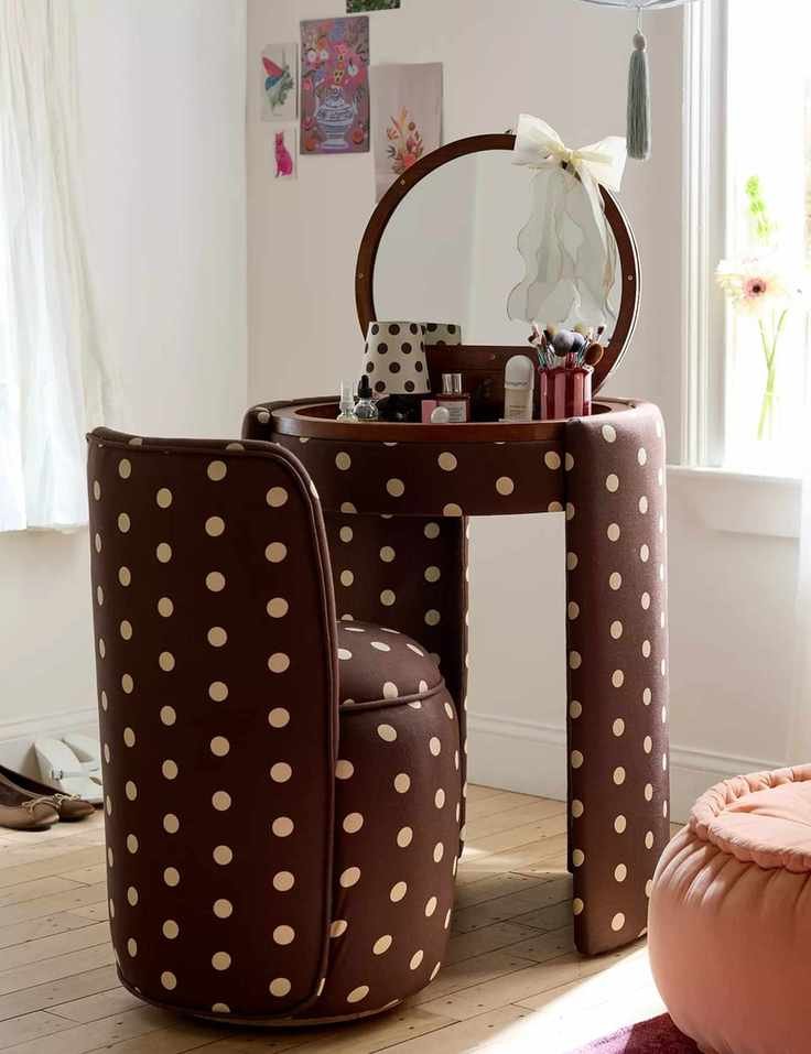 Polka dot Jane Vanity set displayed in a bright bedroom with light hardwood floors and white walls adorned with art