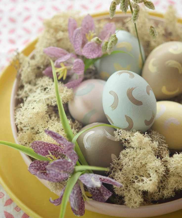 A bowl of painted eggs using pastel benjamin moore paints with swirl markings