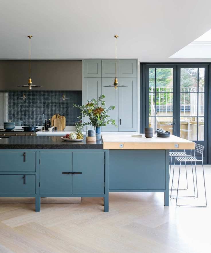 blue kitchen island with mixed worktop