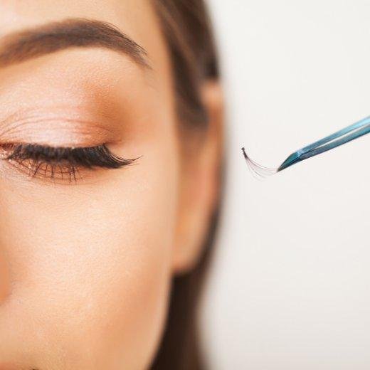 Woman getting eyelash extensions