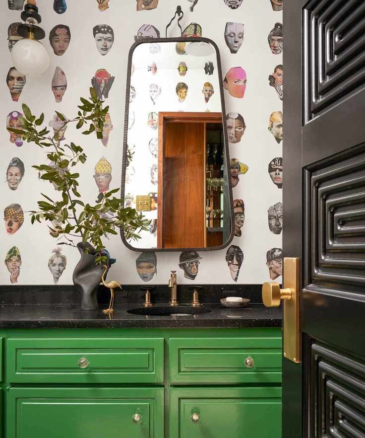 cloakroom bathroom with green vanity and quirky wallpaper
