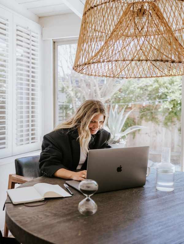 Woman practicing writing rituals at her desk.