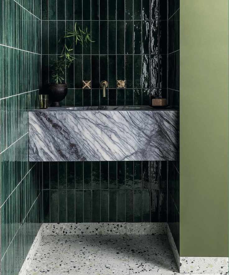 Bathroom with dark green wall tiles