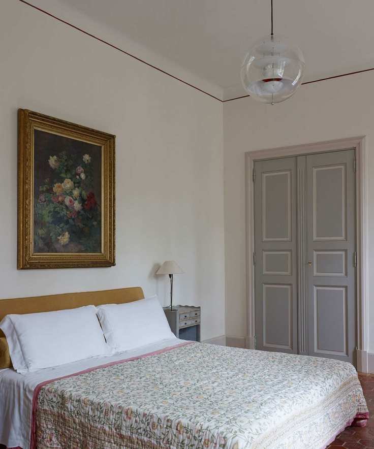 Eclectic bedroom with unique ceiling trim