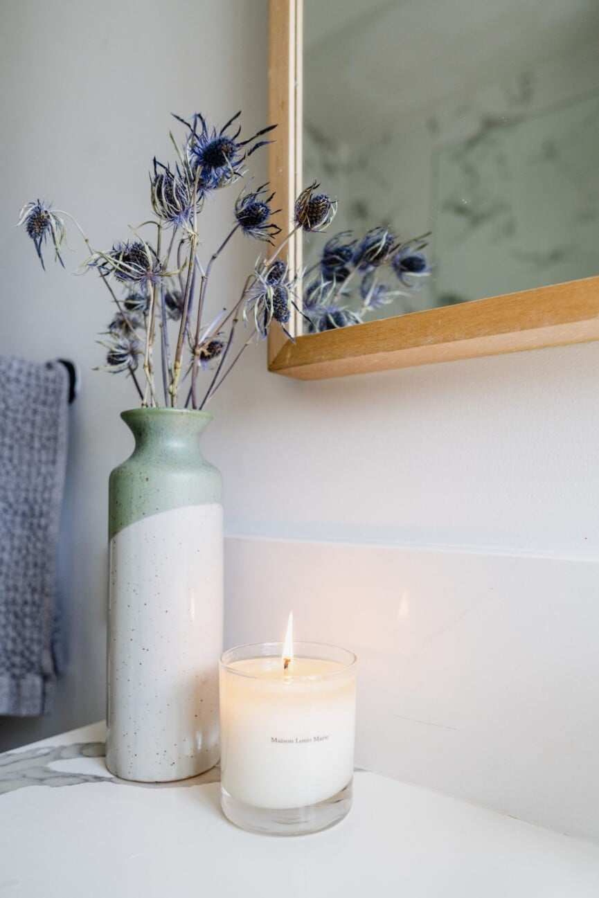 lit candle and vase