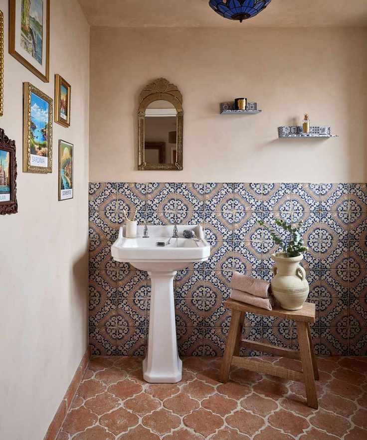 A bathroom with terracotta floor tiles