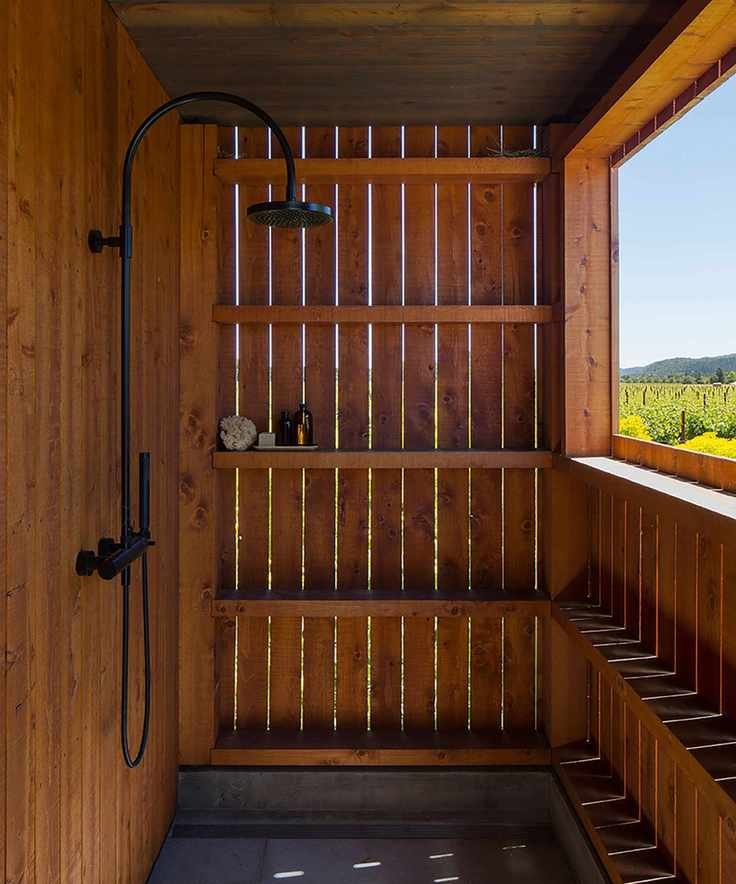 Outdoor shower in wooden enclosure