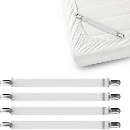 Four white elastic sheet straps for bed sheets