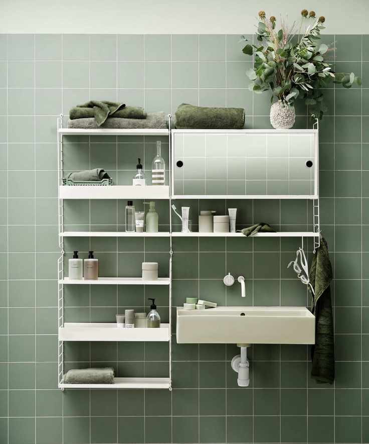 White modular shelving unit positioned over a sink