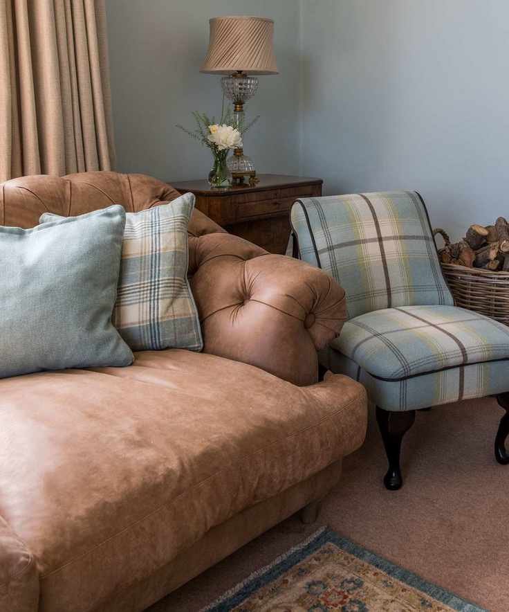 Living room with leather couch and armchair