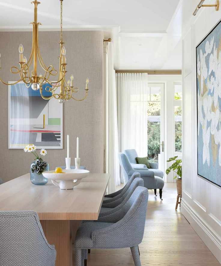 dining room with gray upholstered chairs and pale wood table