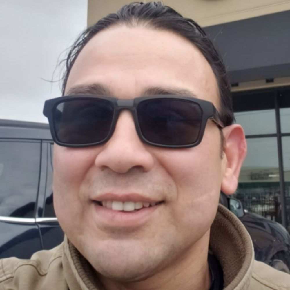 A headshot of Armando Calderon