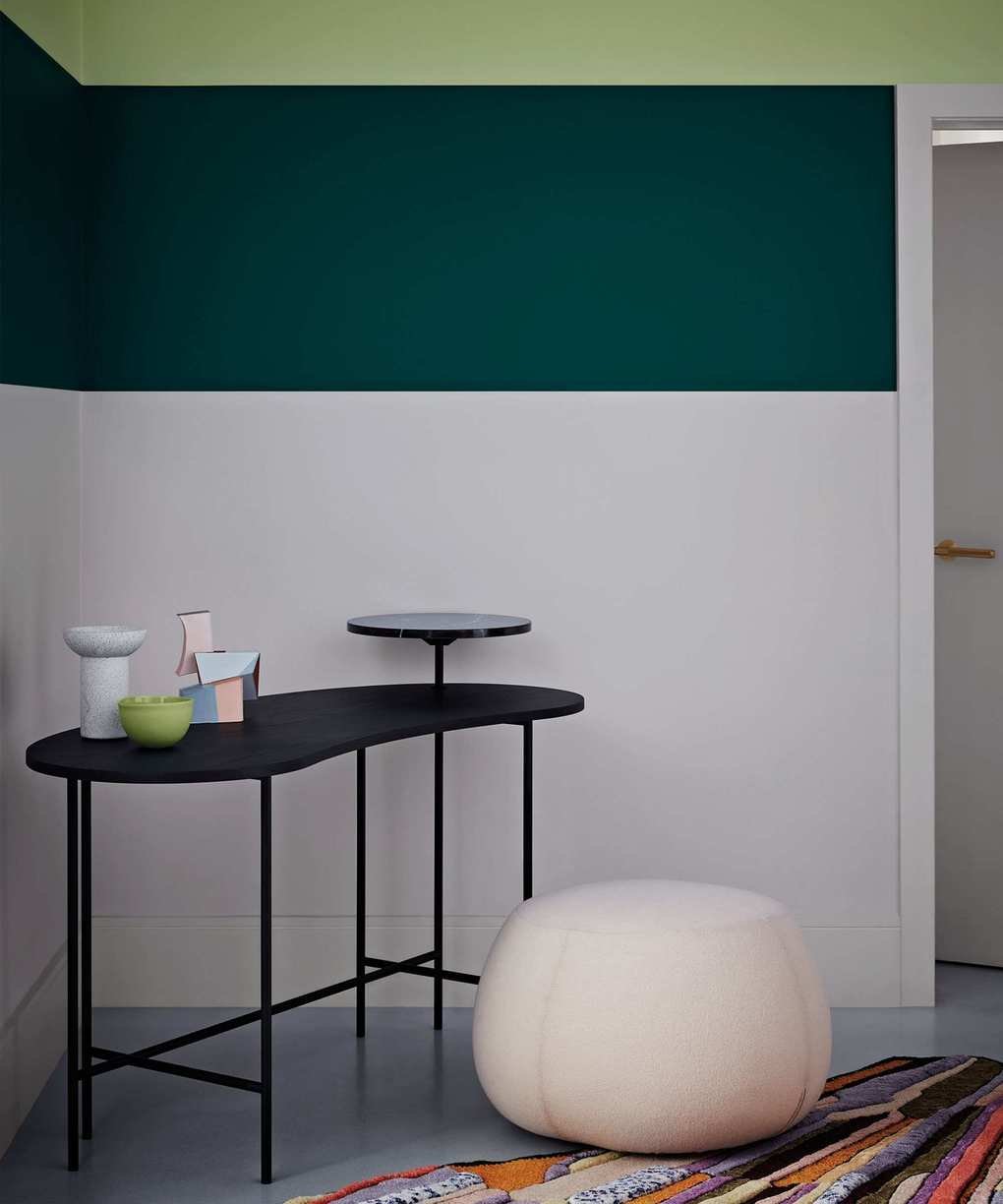 Hallway with white and green walls showcasing two shades of green