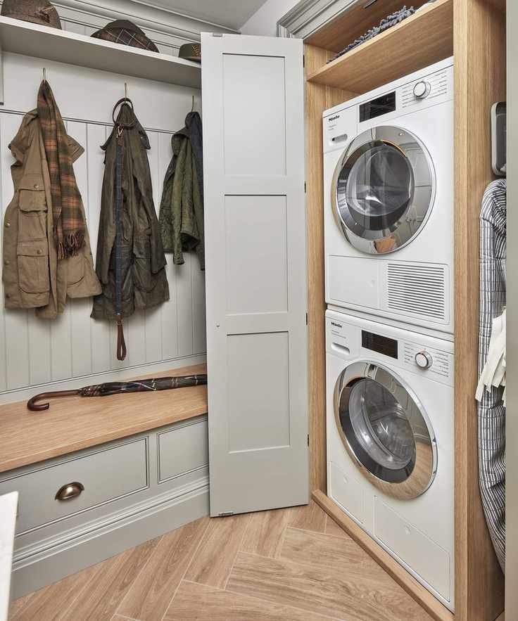 Laundry room featuring stacked washing machine and dryer for space efficiency.